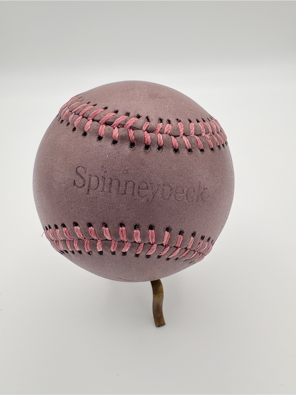 Spinneybeck Reddish Brown Leather Baseball with Pink Stitching